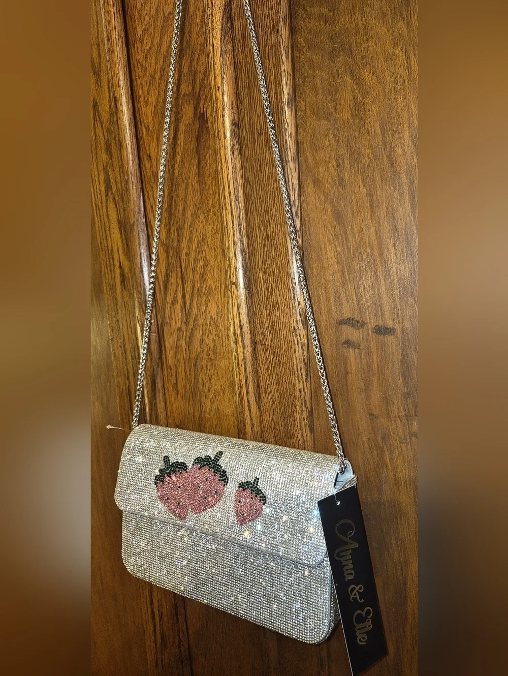 NWT's Rhinestone-encrusted silver clutch from the brand Anna & Elle, Strawberry